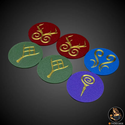 Angled shot of fantasy-themed 40mm objective tokens with matte finish and gold emblems